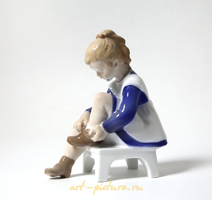 Porcelain figurine (statuette) Marianna. A girl is tying shoelaces Bing Grondahl.