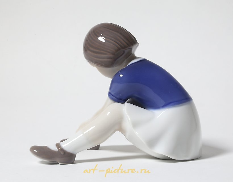 "Girl fastening her shoe. Denmark, Copenhagen, Bing & Grondahl."