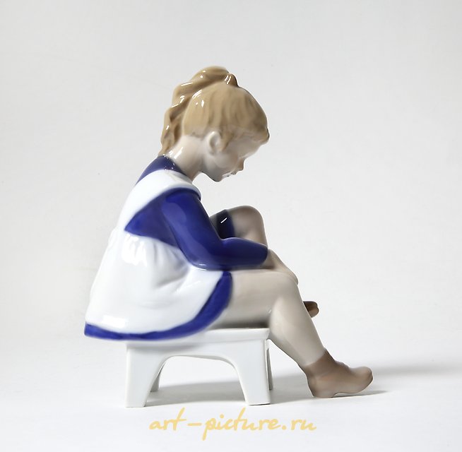 Porcelain figurine (statuette) Marianna. A girl is tying shoelaces Bing Grondahl.