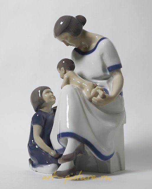 "Mother with two children. Denmark, Copenhagen, Bing & Grondahl."