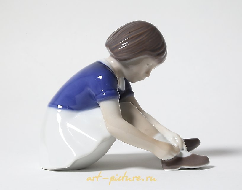 "Girl fastening her shoe. Denmark, Copenhagen, Bing & Grondahl."