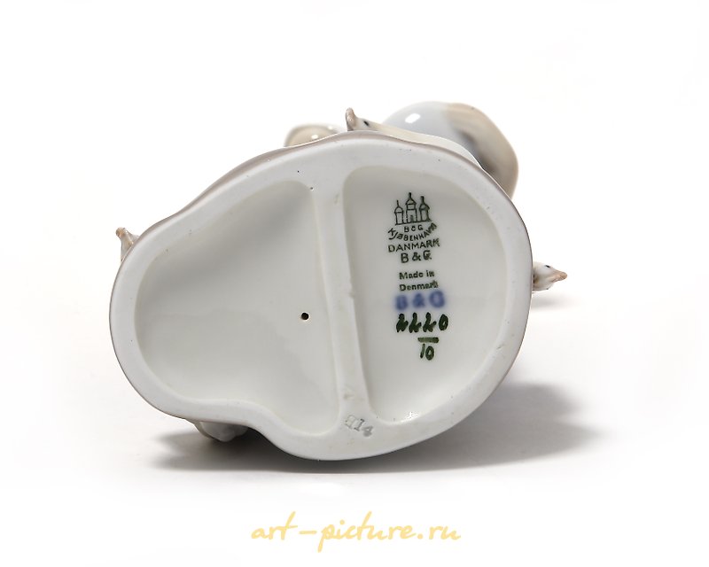 "Girl feeding birds. Denmark, Copenhagen, Bing & Grondahl."