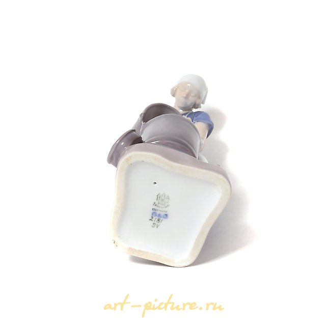 "Girl pouring milk. Denmark, Copenhagen, Bing & Grondahl."