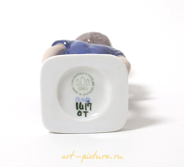 "Kai. A standing boy in shorts. Denmark, Copenhagen, Bing & Grondahl."