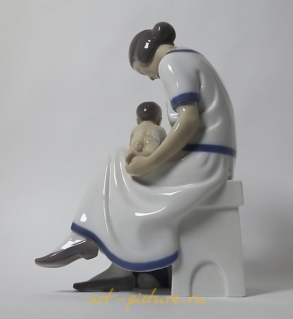 "Mother with two children. Denmark, Copenhagen, Bing & Grondahl."