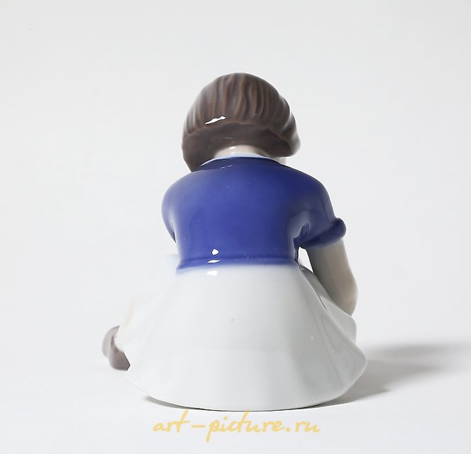 "Girl fastening her shoe. Denmark, Copenhagen, Bing & Grondahl."