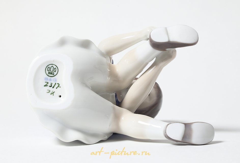 "Girl fastening her shoe. Denmark, Copenhagen, Bing & Grondahl."