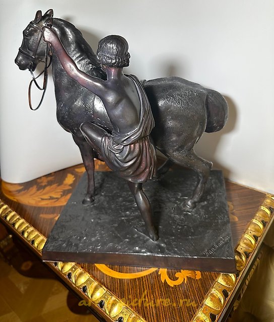 Antique sculpture from the 19th century "Seated Rider (Anichkov Bridge)" by the model's author Peter Karlovich Klodt, 1846. Bronze.
