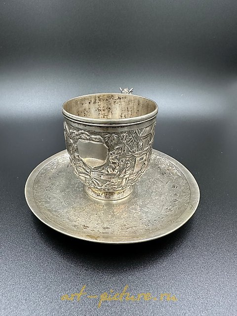 Chinese silver export cup with saucer, featuring a dragon handle and shield. 19th century.
