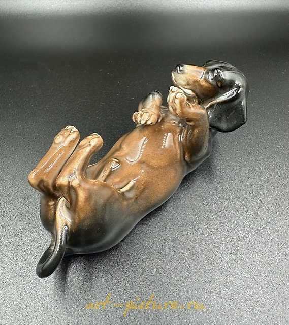 The figurine of a Dachshund lying on its back, Factory Karl Ens Porzellanfabrik Karl Ens.