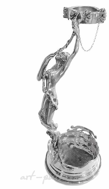 Bottle holder for wine made of silver.
