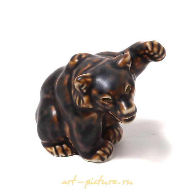 Bear cub with a raised paw. Denmark, Copenhagen, Royal Copenhagen.