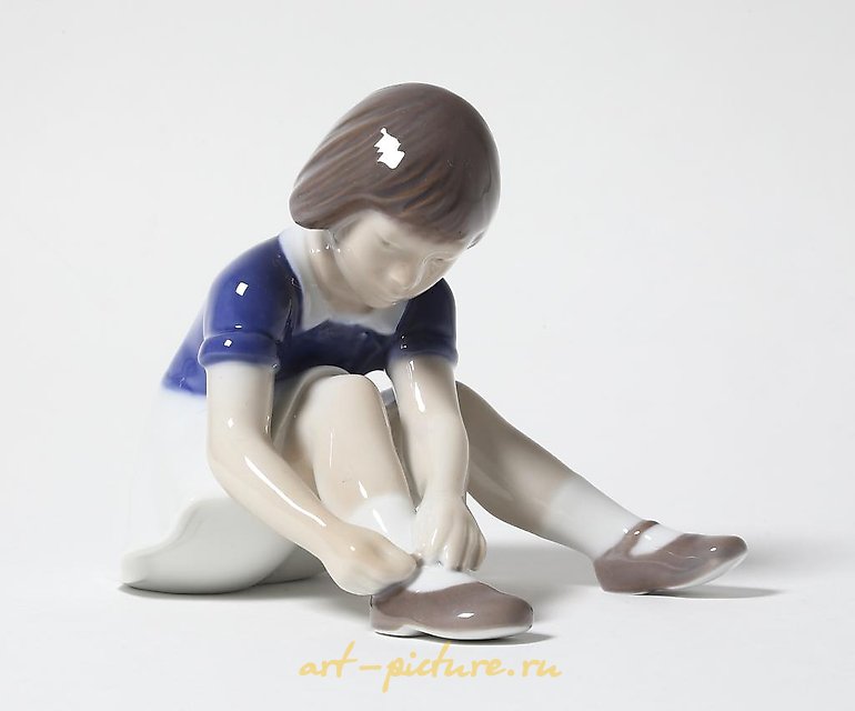 "Girl fastening her shoe. Denmark, Copenhagen, Bing & Grondahl."