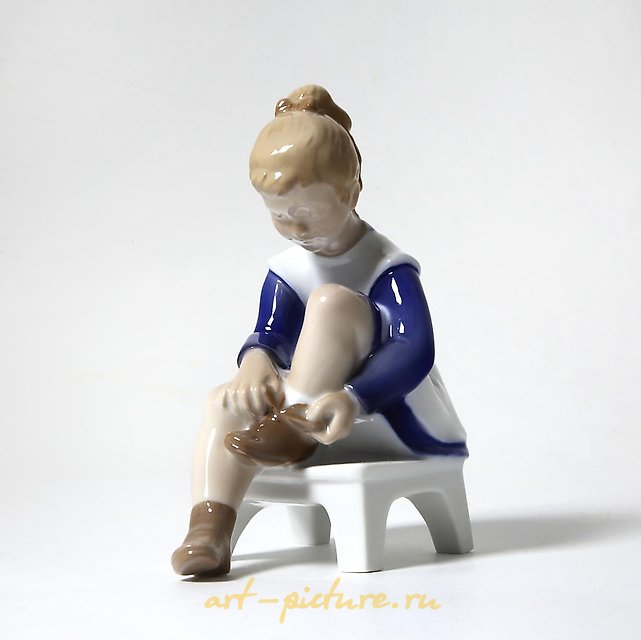 Porcelain figurine (statuette) Marianna. A girl is tying shoelaces Bing Grondahl.
