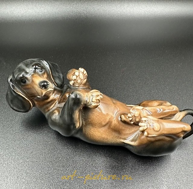 The figurine of a Dachshund lying on its back, Factory Karl Ens Porzellanfabrik Karl Ens.