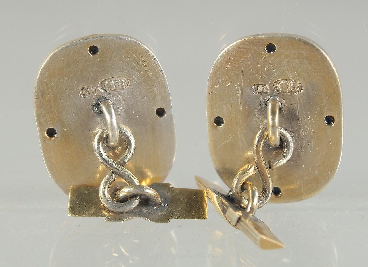 Russian silver , A PAIR OF RUSSIAN SILVER AND BLUE ENAMEL CUFF LINKS with a m...