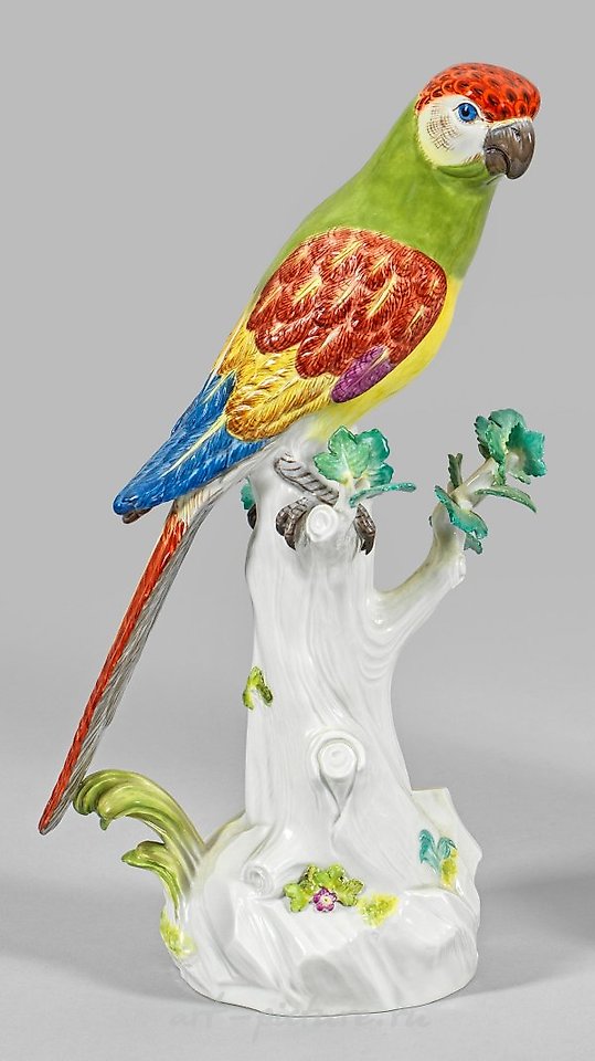 Papagei auf Stamm translates to "Parrot on a Branch" in English.