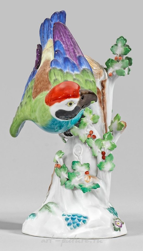 Papagei auf Stamm translates to "Parrot on a Branch" in English.