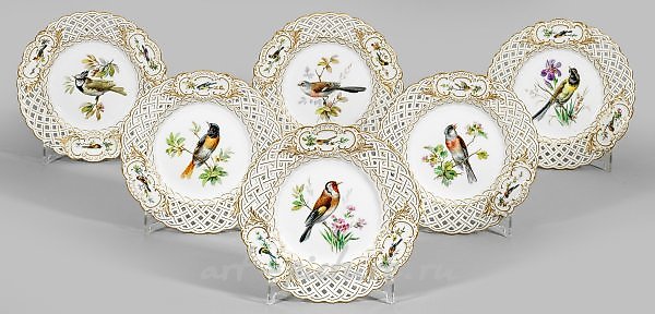 Six decorative plates with bird decor.