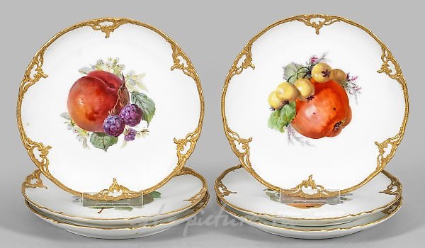 Six dessert plates with fruit decoration.