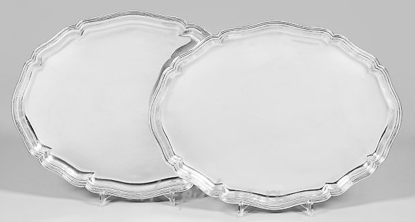 Two large, classical serving platters.