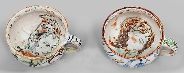 Two unique tea cups with painted decor by Cornelia Schleime.