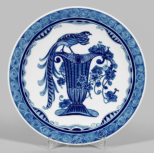 Art Nouveau wall plate with a "bird vase motif" in blue painting.