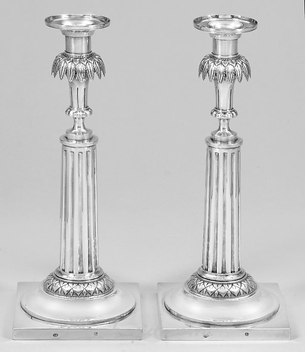 A couple of exquisite Empire table candlesticks.