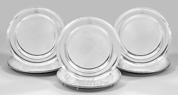 Sentence of twelve elegant and heavy place settings.
