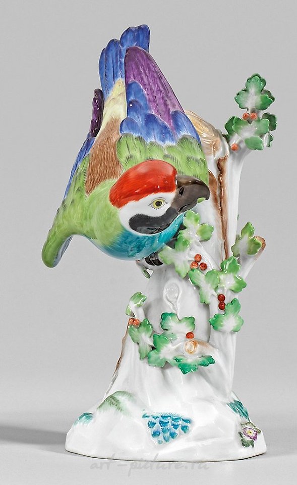 Papagei auf Stamm translates to "Parrot on a Branch" in English.