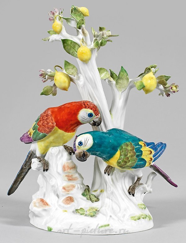 Papageiengruppe an einem Zitronenbaum translates to "Group of parrots on a lemon tree."