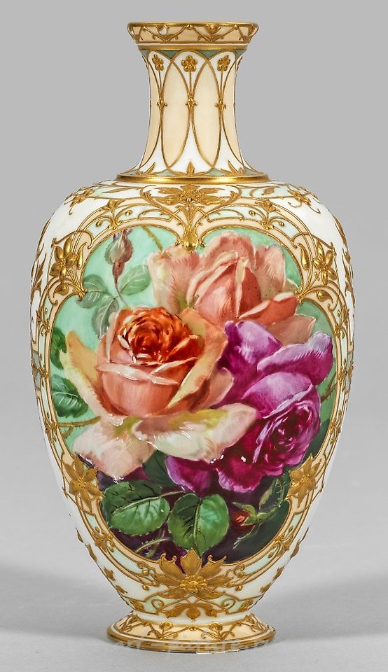 Magnificent ornamental vase with relief gold and rose decoration.