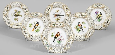 Six decorative plates with bird decor.