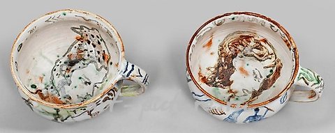 Two unique tea cups with painted decor by Cornelia Schleime.