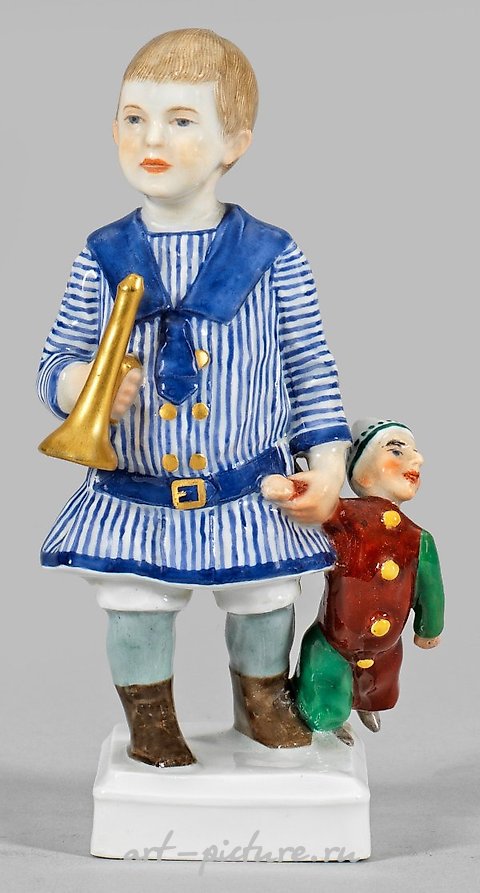 Art Nouveau Figure "Young Boy with Trumpet and Kasperle"

In this exquisite Art Nouveau sculpture, we are presented with a captivating portrayal of a young boy, skillfully crafted with meticulous attention to detail. The artist has masterfully captur