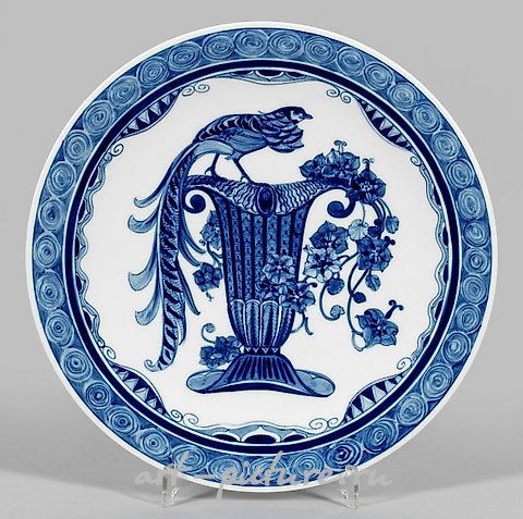 Art Nouveau wall plate with a "bird vase motif" in blue painting.