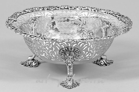 George III - Durchbruchschale

The Durchbruchschale, or pierced bowl, of George III is a remarkable piece of artistry that exemplifies the exquisite craftsmanship of the Georgian era. This stunning creation showcases the mastery of the silversmith, w