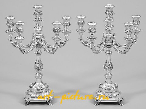 A pair of girandoles in the Baroque style.