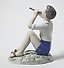 Porcelain figurine of a Boy Playing the Flute by Bing Grondahl.