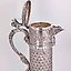 The translation of "Серебряный кувшин" into English is "Silver pitcher."