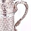 The translation of "Серебряный кувшин" into English is "Silver pitcher."