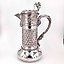 The translation of "Серебряный кувшин" into English is "Silver pitcher."