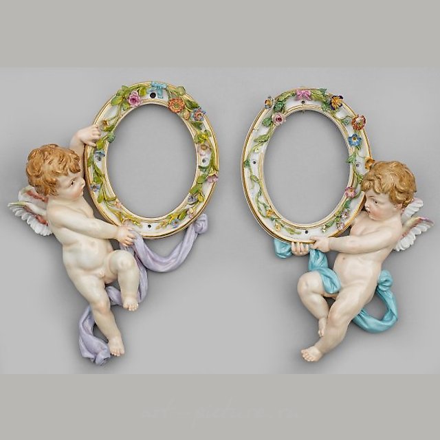 A couple of rare small wall mirrors with Amoretto.