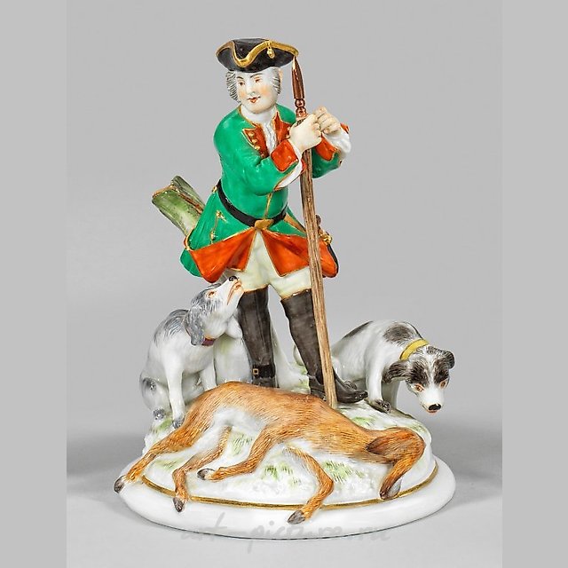 Hunter with dogs and a slain deer