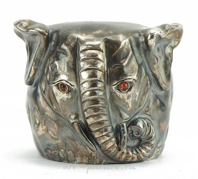 Silver model of a reclining pig with ruby eyes, impressed Ru...