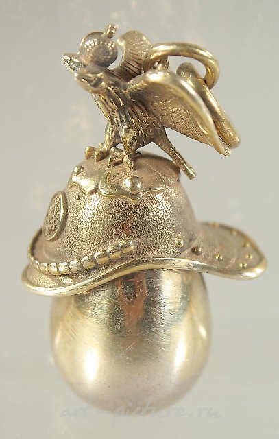 A RUSSIAN SILVER HELMET AND EGG PENDANT.