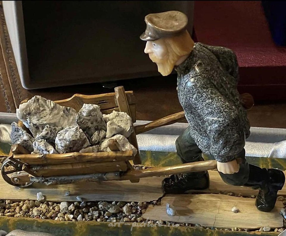Author's stone sculpture "Miner," Ural school of three-dimensional mosaics.
