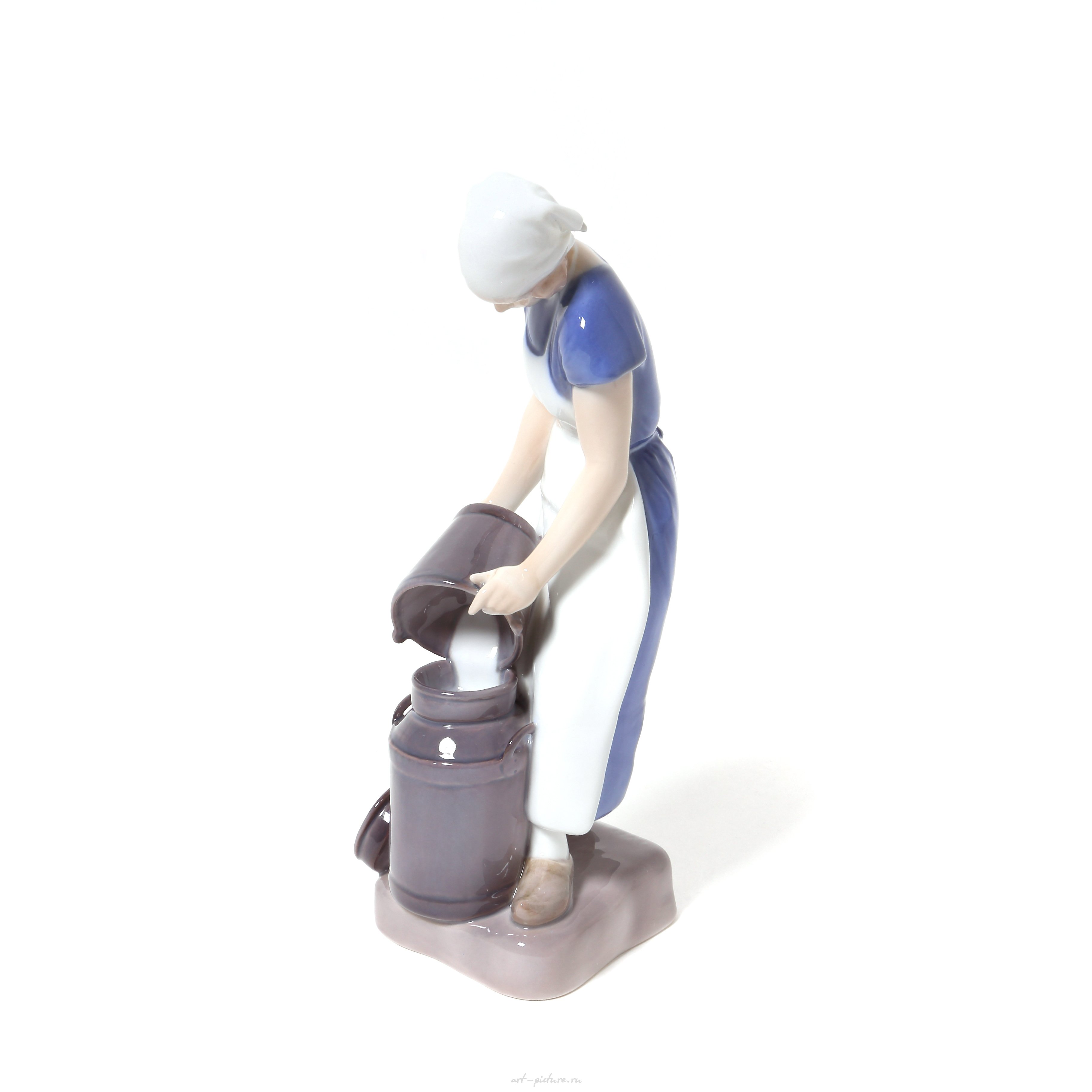 "Girl pouring milk. Denmark, Copenhagen, Bing & Grondahl."