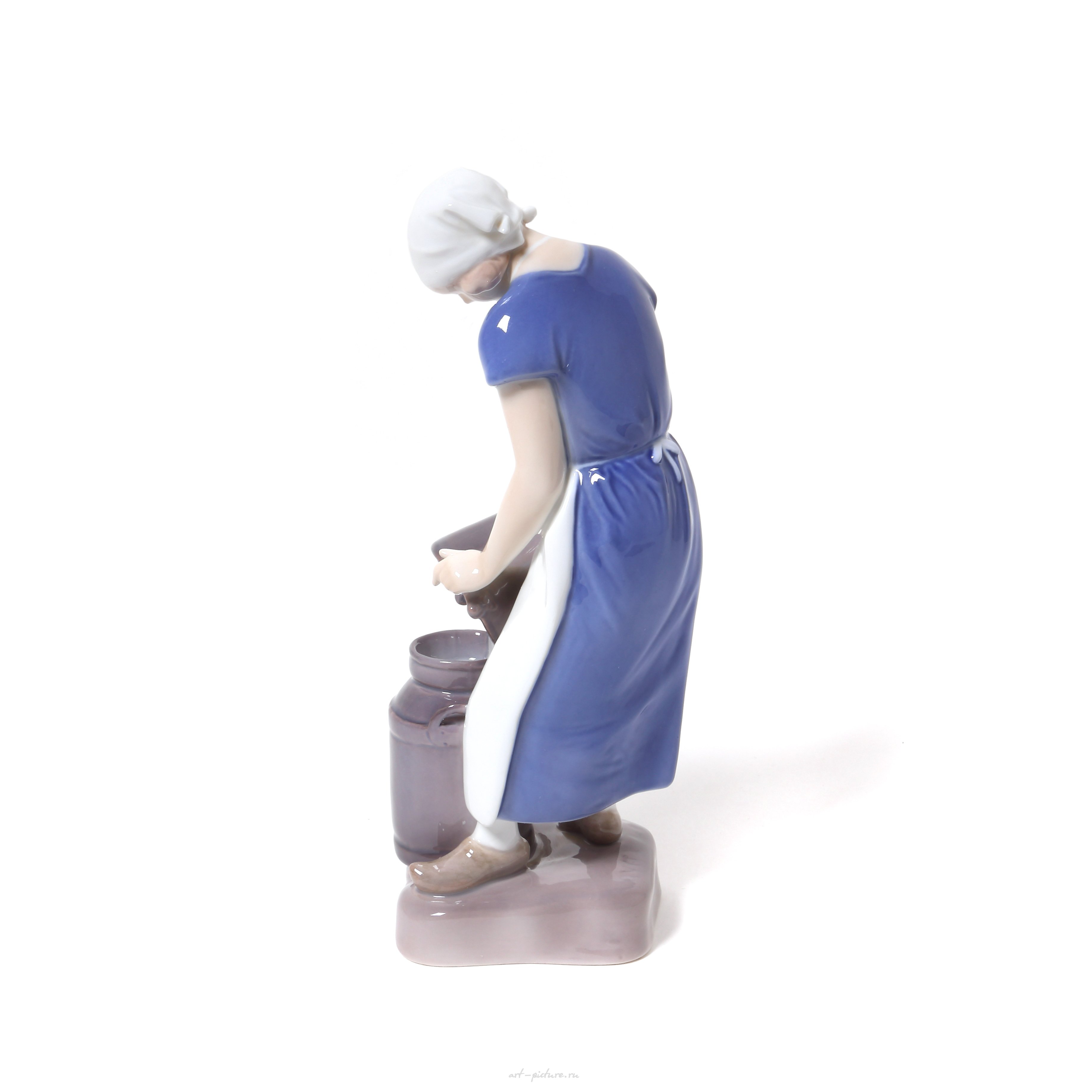 "Girl pouring milk. Denmark, Copenhagen, Bing & Grondahl."