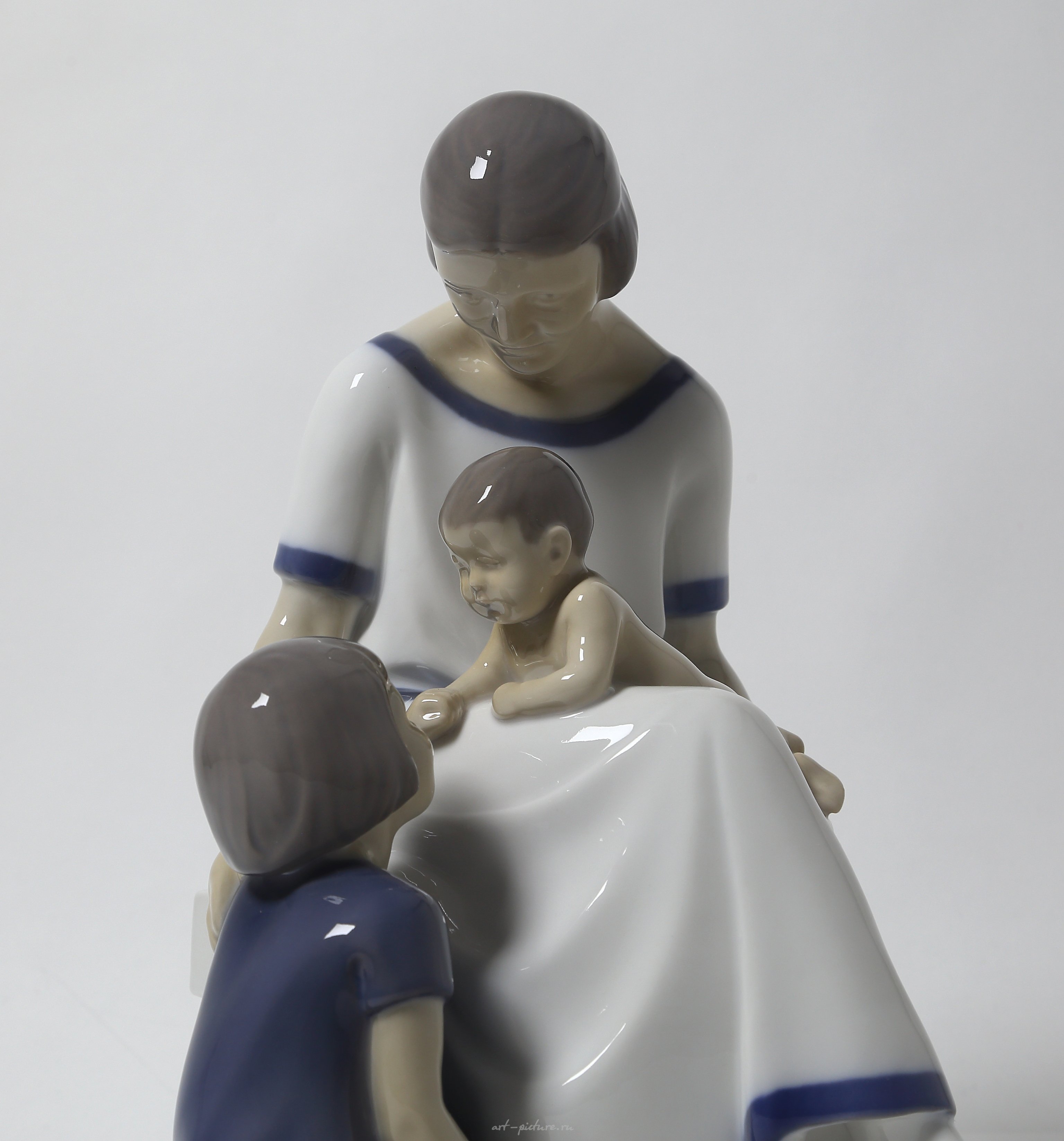 "Mother with two children. Denmark, Copenhagen, Bing & Grondahl."